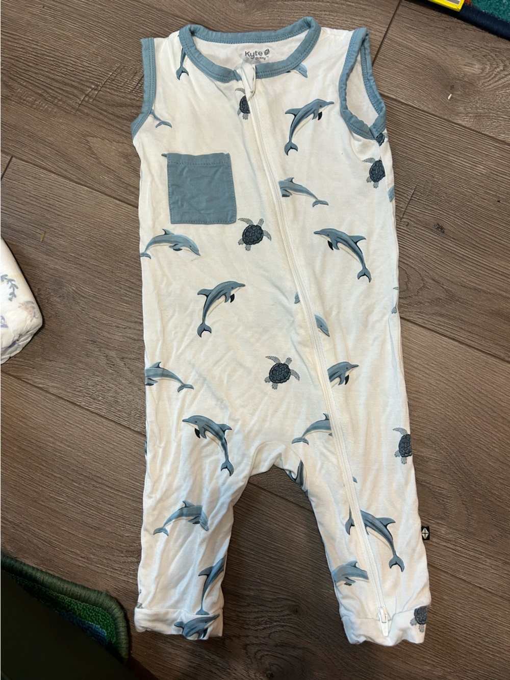 Kyte BABY White Sleeveless Zip Romper with Blue Dolphin Print